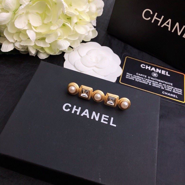 Ch*el brooches